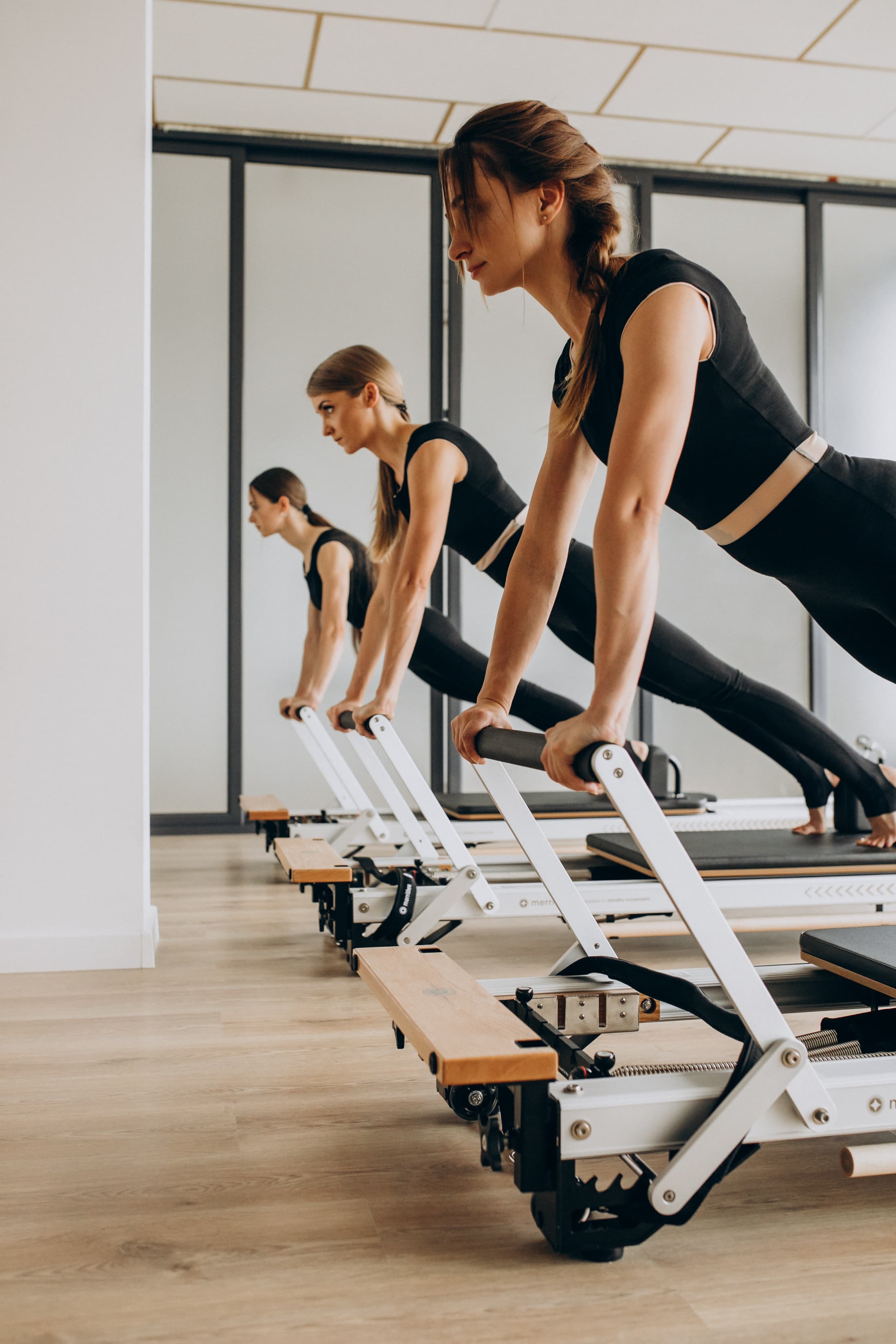 Pilates instructors on reformers